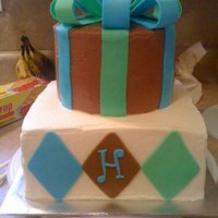 Chocolate, Green, And Blue Baby Shower Cake chocolate, green, and blue baby boy shower cake with fondant bow