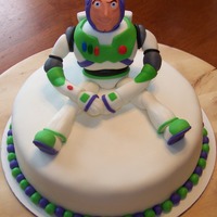 Buzz Lightyear Fondant Buzz Lightyear figure/chocolate cake with cream cheese icing.