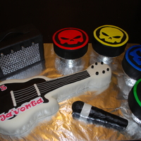 Party Like A Rock Star Rock Star cake for a 5 year old little boys birthday party. Fun! Four drums are 6 inch round cakes and the guitar is cake. The Microphone...