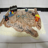 Treausre Map Made for a Scavenger Hunt Birthday Party for a 10 year old. The figures are modeling chocolate as is the map itself. i used hot cocoa mix...