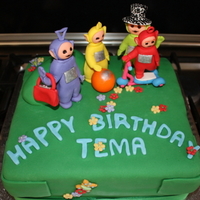Teletubbies This was a Carrot Cake with Cream Cheese frosting. All the characters and accents were made of gumpaste.