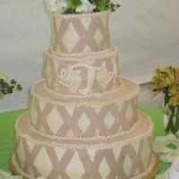 4 Tier Round Wedding Cake Marble pound cake with cream cheese filling and vanilla pound cake with cream cheese filling. MMF "X" colored with cocoa to be a...