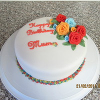 Roses Birthday Cake Sugarpaste roses with a trio coloured piping