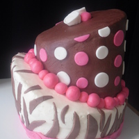 Pink And Brown Topsy Turvy My second topsy turvy cake. Bottom tier- BC with chocolate fondant zebra stripes. Top tier- chocolate BC with MMF accents.