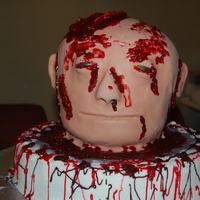 Severed Head Head and base are all cake the "blood" is colored piping gel, this is the grosest thing I have ever done or will ever do again.