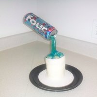 Pouring Four Loko Malt Liquor Cake! "Styrofoam cup" made of cake and MMF. Everything edible except the can. This really turned out horrible!! The flash helped cover...