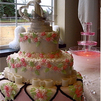 Heart Shaped With Drop Flowers This cake has over 800 drop royal icing flowers and fondant heart overlays