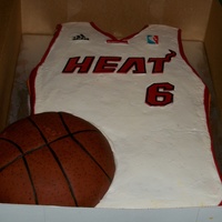 Miami Heat Jersey Half sheet cake (red velvet) basketball (chocolate) with fondant accents.