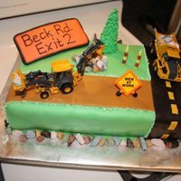 Bulldozer Cake I did this cake for my nephew's birthday. It was 2-9x13 cakes stacked then covered in fondant. Everything on the cake was edible...