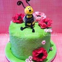Buzzy This cake is small, only a 4" round. Bee & flowers all made out of fondant with gum tragacanth added.