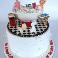 Wedded Bliss Fun 40th Anniversary cake...extra tall cake is dark chocolate mud filled & covered with chocolate ganache, finished in fondant icing....