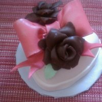 Cake For 2 4" strawberry cake covered in MMF with fondant/gumpaste bow, leaves and chocolate roses.