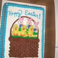 Easter Cake 1/4 sheet cake decorated for Easter. The bunnies and chicks are suckers that I stuck into the basket.