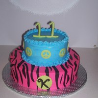 Zebra Stripes And Peace Signs white cake covered in BC and zebra stripes, peace signs and 11 was made of MMF.