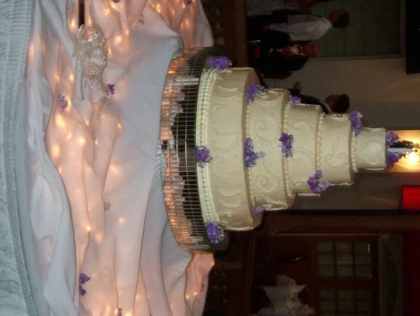 Allies Cake I made this cake for my cousins wedding! It was my first wedding cake. It is a five-tiered ivory cake. I used buttercream frosting and real...