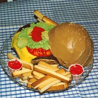 Hamburger Cake The hamburger cake is made with the 3-D ball pan. The top is sprinkled with sesame seeds. The patty was made from a round piece of...