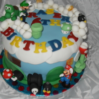 Super Mario Cake all edible apart from Mario and luigi. thanks for looking :)