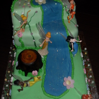 Tinker Bell Fairy Cake 3 tier sponge cake waterfall cake. These are not the fairies that were to go on it so they are not positioned well as i had to take care...