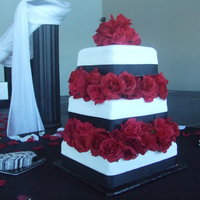 Square Roses 12, 10, 8 inch square. MMF over good amount of BC. Silk roses. Yellow, Chocolate and Red Velvet (cream chz icing). 3rd cake ever, was...