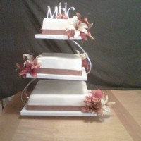 Floating Wedding Cake We made this cake for a good friend of ours. The floating tiers were very elegant. We used fall colors to match her decor. White...