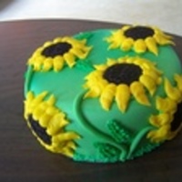 Sunflowers This is a small cake made for someone who loved sunflowers. Marshmellow fondant with buttercreme sunflowers.