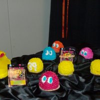 Ms Pac Man Cake My 15 yr old made this birthday cake for my 80"s themed party. She used the ball pan for ms pac man and the mini doll molds for the...