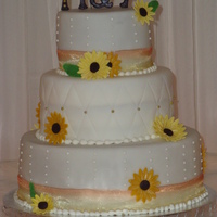 Sunflower Wedding Cake a 6, 9 and 12 inch cake with sunflowers