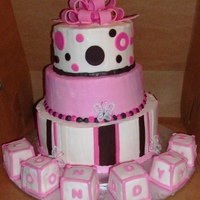 Baby Londyn 3 round tiers butter cream w fondant accents....blocks covered in fondant...