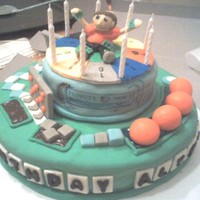 Game Show Party Cake Ok, be kind. This is my first upload. 3rd fondant cake, 1st time making gumpaste figures, stacking, and using ganache (gumpaste gave me a...