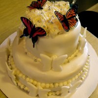 Butterfly Wedding Cake All edible except for colored butterflys.Fondant/Buttercream