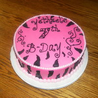 Zebra Stripes Vanilla Cake filled with fresh strawberries, iced and decorated with buttercream