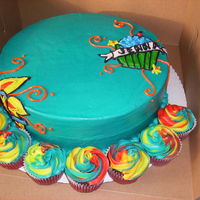 Cool Cake Chocolate Cake filled w/ choc pudding. Iced and decorated with buttercream. Cupcakes are red velvet w/cream cheese filling.