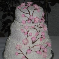 Cherry Blossom Wedding Cake This was my first wedding cake made for a friend. Yellow cake with buttercream and gumpaste flowers.
