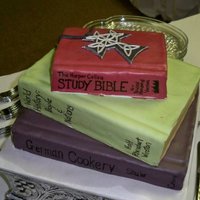 Stack Of Books fondant covered books with fondant replica of groom's Celtic cross.