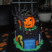 Spooktacular Grave The is my first halloween cake and my third fondant cake.The casket is a chocolate cake with Vanilla-Almond buttercream and Fondant, The...