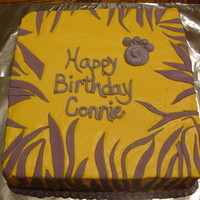 Lsu This was made for a co-worker. White cake with chocolate bc filling. Covered in bc with mmf stripes. This was a little harder than it...