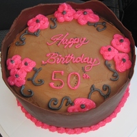 50Th Birthday Cake strawberry cake with cookies and cream filling and chocolate buttercream icing and a chocolate wrap (my first attempt at a wrap!)