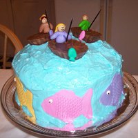 Sunday Afternoon I call this cake, Sunday Afternoon. The fisherman are fondant and gumpaste. The boats are chocolate and peanutbutter melting wafers loosely...