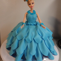 Princess Anna This is a strawberry cake, with strawberry buttercream icing, both in pink, covered in Wiltons royal blue and teal colored fondant. Fondant...