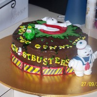 Ghostbusters Cake this is a 9inch round strawberrycake covered in choc ganche ghostbusters theme for my daughters 6th bday all handmade fondant models and...