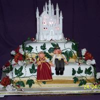Medieval Wedding Cake this was for my sister with her medieval themed wedding the top castle is bought and at sisters request , the first tier is choc/caramel...