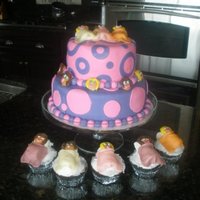 Slumber Party Polka dot slumber party cake. Little sleepers on top of cake as well as on additional cupcakes.