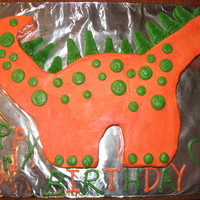 My First Dinosaur Cake vanilla cake with orange and green buttercream frosting