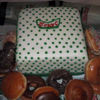 Krispie Kreme This was a grooms cake for a police officer. I wanted to make some fonsant bacon, but didn't have time. =)