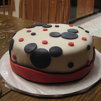 Mickey Mouse Cake Vanilla cake covered with marshmallow fondant and Mickey Mouse made of rice krispies covered with white chocolate and marshmallow fondant