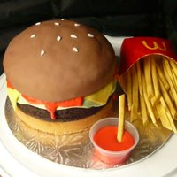 Smaller Version Of Burger And Fries The burger buns are marble cake, and the meat is brownie !! Fries made outta yellow fondant and dusted with food colour powder [tree bark...
