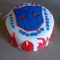 Optimus Cake Chocolate cake, chocolate pastry pride mousse filling, covered in buttercream and mmf.