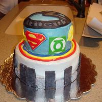 View Of Sides. Two tier faux fondant Justice League cake for my dh's birthday. This was my first attempt at making a cake. It was a surprise for dh&#...