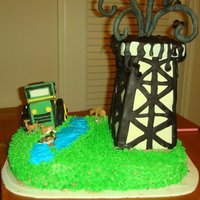 Ranch And Oil Rig Cake German chocolate with chocolate buttercream. Cake was made to look similar to his ranch with tractor and oil rig.
