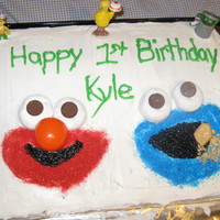 Elmo & Cookie Monster 1St Birthday Cake My guys love Sesame Street. So for the youngest little mans 1st birthday I did Elmo and Cookie Monster. The Sesame Street figures along the...